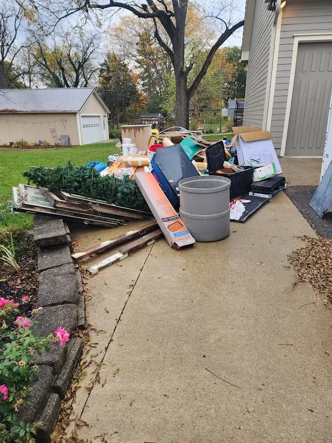 Dumpster being loaded with debris for 3 Yard Dumpster Rental in Abilene